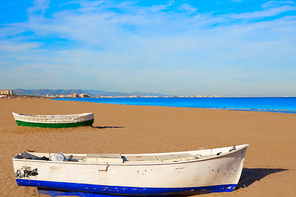 Valencia La Malvarrosa beach boats stranded in Mediterranean Spain