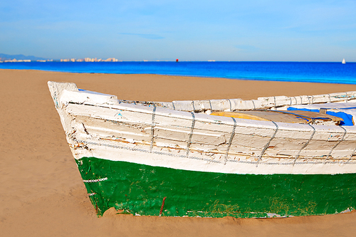 Valencia La Malvarrosa beach boats stranded in Mediterranean Spain