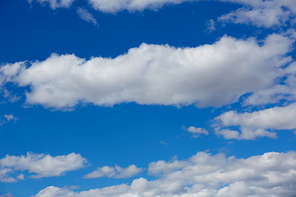 Blue summer sky in Mediterranean sea with white clouds