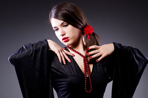 Young attractive woman dancing flamenco