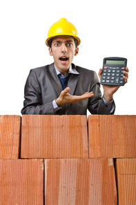 Businessman with bricks on white