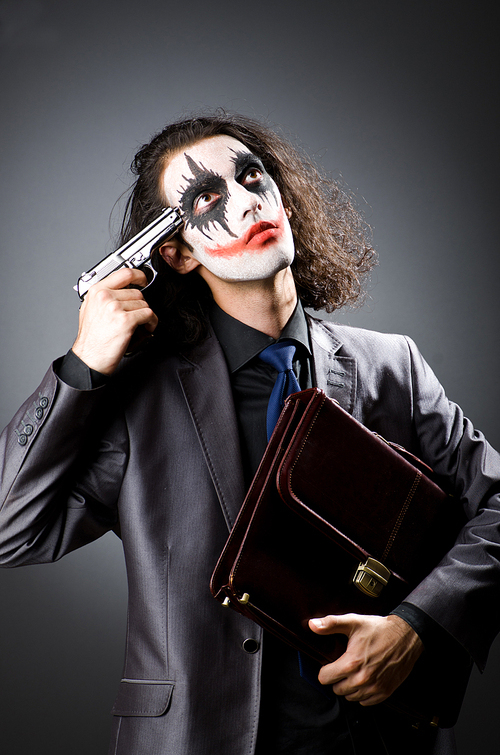 Joker with gun and briefcase