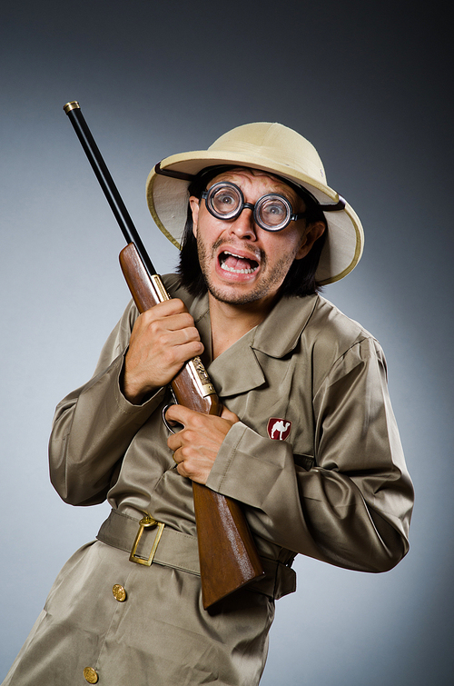 Funny safari hunter with rifle