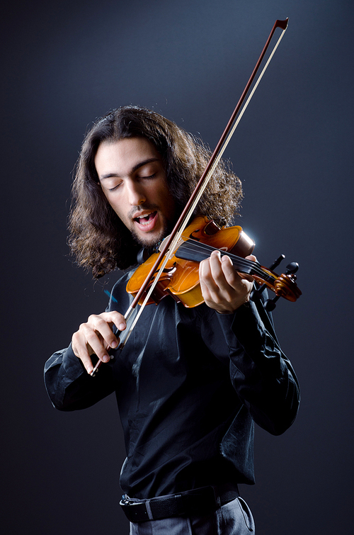 Young violin player playing