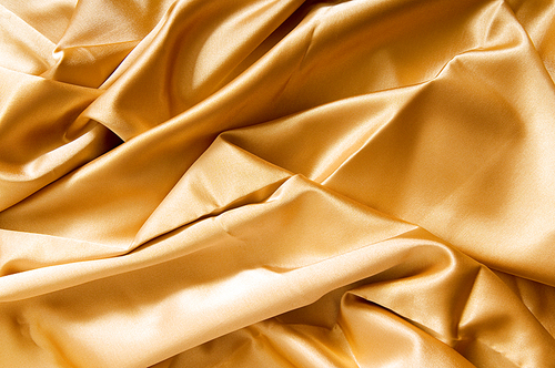 Bright satin fabric folded to be used as background