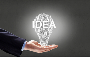 Businessman holding in hands successful idea concept