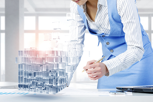 Close view of businesswoman writing on papers and 3D illustration cube figure as technology concept