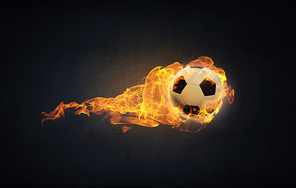 Conceptual image of football ball in fire flames