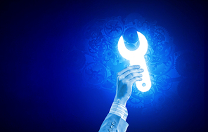 Person hand taking glowing tool sign on blue background