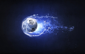 Conceptual image of soccer ball in water splashes