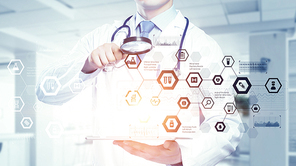 Medicine doctor working with modern digital tablet pc interface