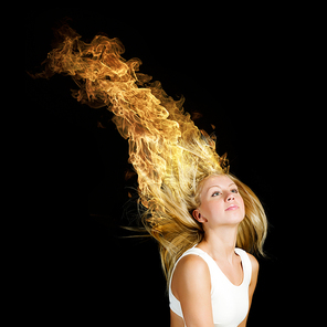 Young attractive blond woman with hair in fire flames