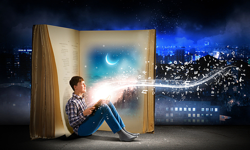 Teenager boy wearing jeans and shirt and reading book