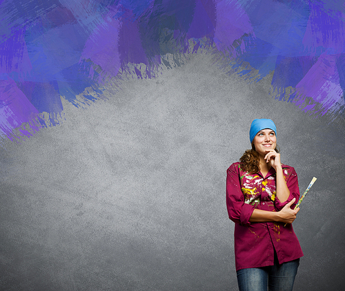 Young girl painter with brush wearing bandana