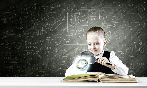 Schoolgirl examining opened book with magnifying glass. Elements of this image are furnished by NASA