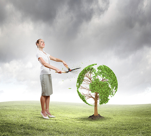 Young businesswoman cutting tree with scissors in shape of Earth planet