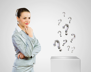 Image of concentrated businesswoman looking for answer