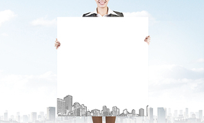 Young businesswoman showing white banner with construction sketches