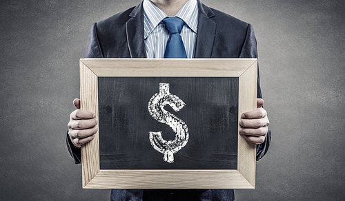 Close up of businessman holding chalkboard with business ideas