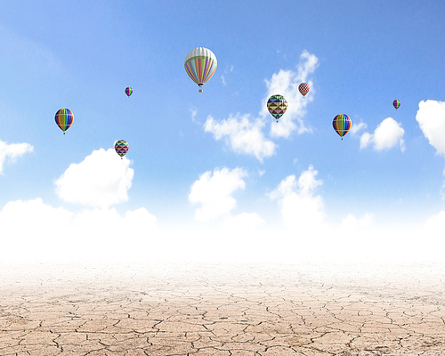 Conceptual image with colorful balloons flying high in sky