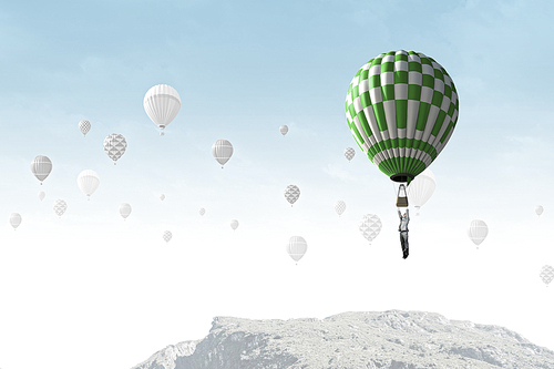 Businessman flying in search of ideas hanging on balloon