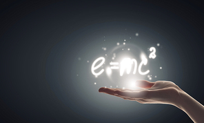 Close up of hand holding science formula icon