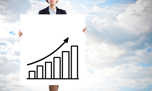 Businesswoman holding poster with growing arrow graph