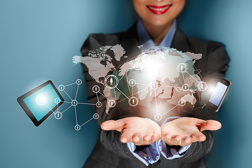 Close up image of businesswoman with 3d images of devices in her hands