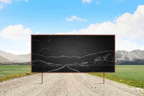 Young businessman in glasses and blackboard with drawings