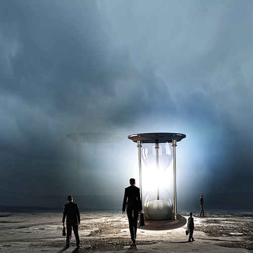 Conceptual image of business people looking at sandglass
