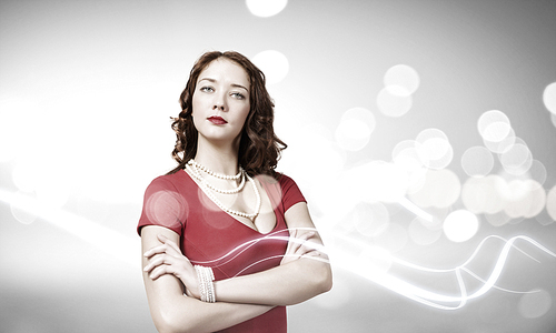 Portrait of young pretty woman in red dress