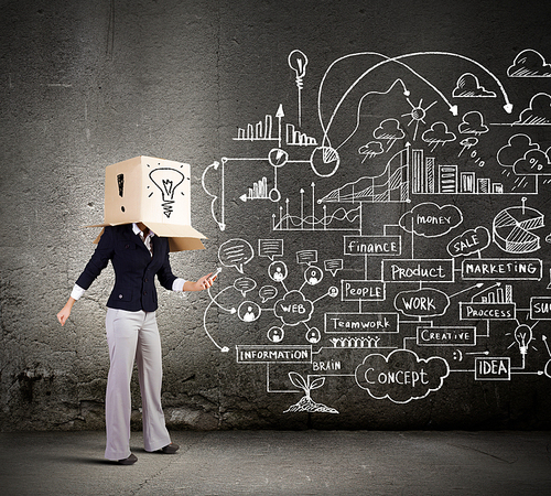 Conceptual image of businesswoman with carton box on head