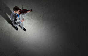 Top view of young businessman playing violin