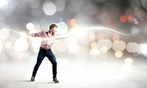 Young man in casual throwing light splashes