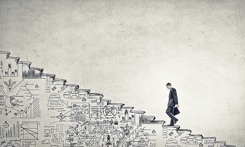 Businessman climbing up hand drawn staircase as symbol of career rise