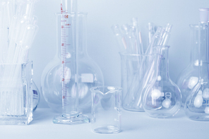 Research lab assorted glassware equipment in blue tone