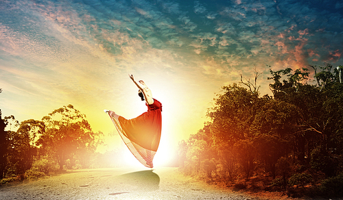 image of female dance dancing outdoor against sunset background