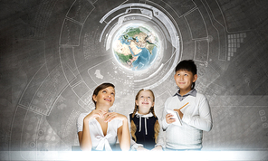 Young teacher and her pupils examining Earth planet. Elements of this image are furnished by NASA