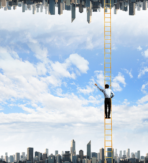 Businessman standing on ladder between two realities