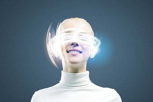 Young woman in white against media background wearing headphones
