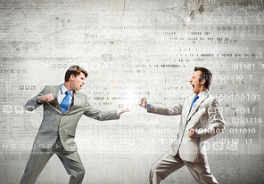 Two businesspeople in anger fighting with each other