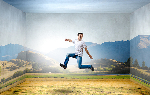Young man jumping in sky in 3d room
