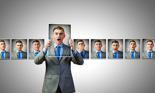 Young handsome businessman expressing different state of mood