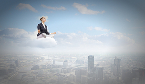 Young attractive lady sitting on cloud and practicing yoga