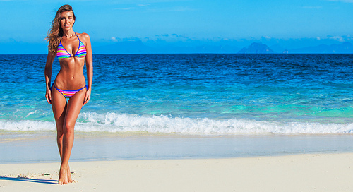 pretty slim woman at tropical sea beach