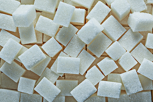 Heap of white sugar cubes food concept.