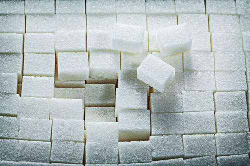 White sweet sugar cubes food concept.