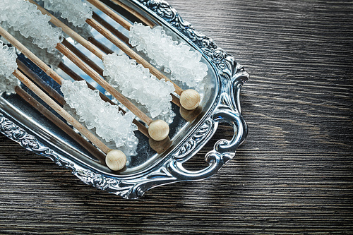 Sugar sticks on metallic tray food concept.