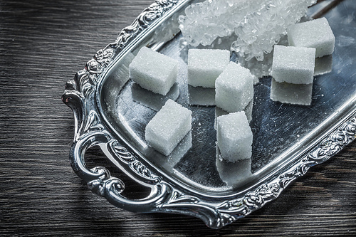 Sugar cubes sticks on tray.