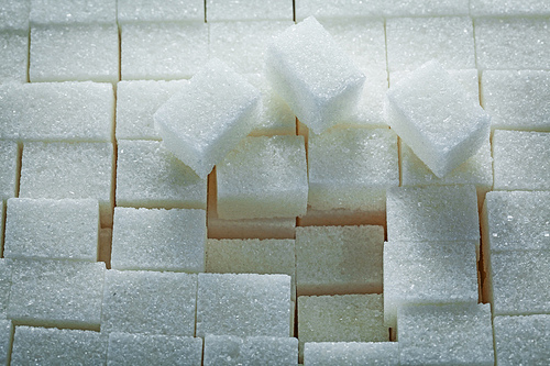 Stack of sugar cubes food concept.